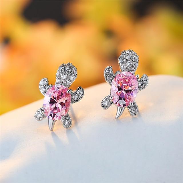 Elegant silver earrings with cubic zirconia and seaweed design