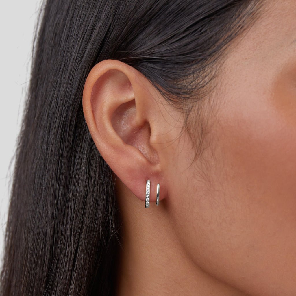 Elegant silver earrings with crystal claw design