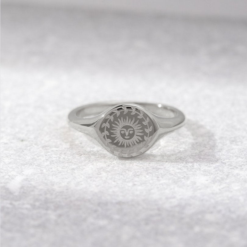 Silver ring with sunburst motif