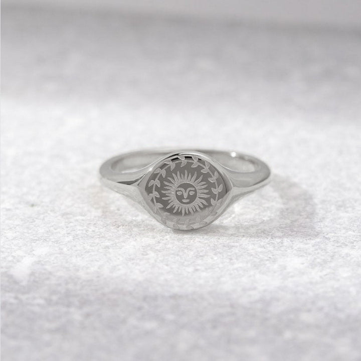 Silver ring with sunburst motif