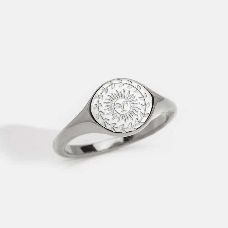 Silver ring with sunburst motif